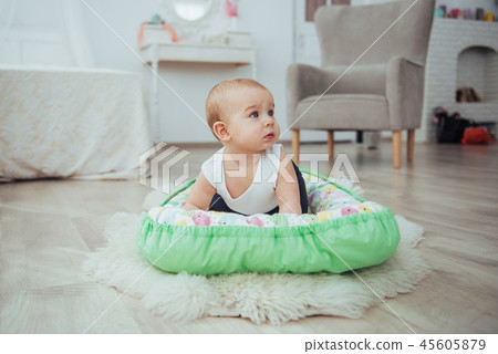 Bedding for children. The baby sleeps in bed. A healthy little baby soon after birth. Bedding for children. The baby sleeps in bed. A healthy little baby soon after birth. 45605879
