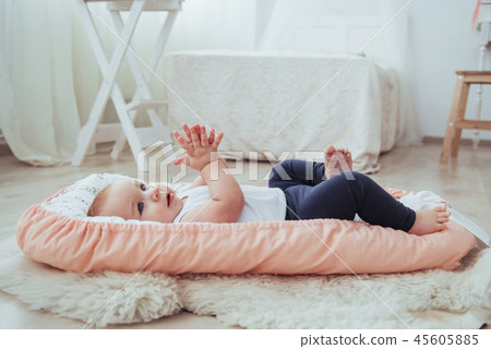 Bedding for children. The baby sleeps in bed. A healthy little baby soon after birth. Bedding for children. The baby sleeps in bed. A healthy little baby soon after birth. 45605885