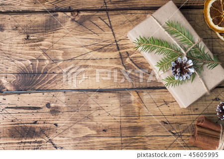 Christmas gift wrapped with decorations  45605995