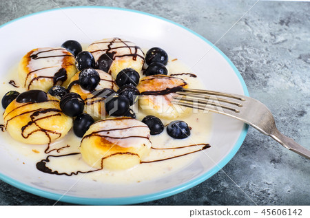 Curd products in sweet sauce with berries 45606142