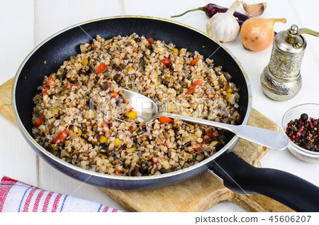 Buckwheat porridge with vegetables in pan 45606207