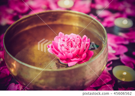 Tibetan singing bowl with floating pink peony 45606562