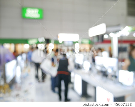 Blurry background of exhibition expo with crowd 45607138