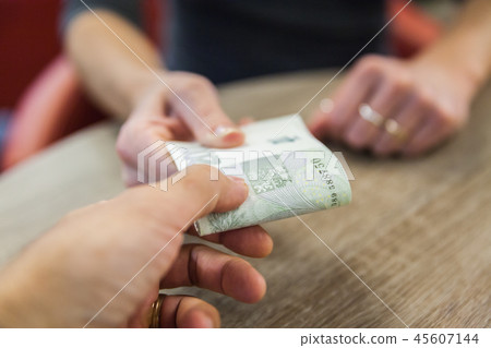 The money is handed over for the cash purchases 45607144