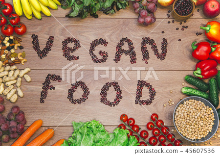Go vegan concept green organic vegetables & bean on wood background. Go vegan concept green organic vegetables & bean on wood background. 45607536