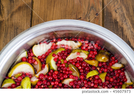 Cooking  fresh pear and cranberry 45607973