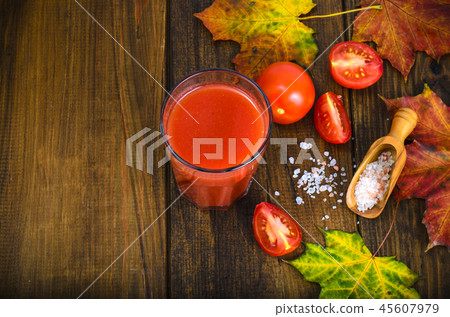 Natural juice with pulp from fresh ripe tomatoes Natural juice with pulp from fresh ripe tomatoes 45607979