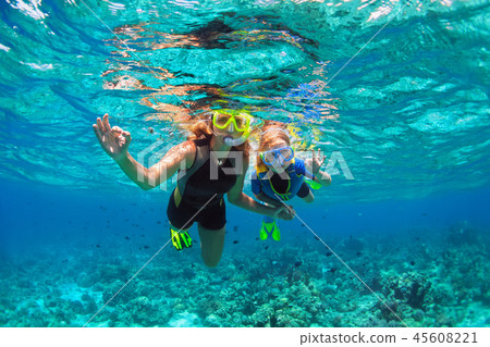 Mother, kid in snorkeling mask dive underwater 45608221