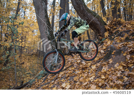 Photo of athlete man in helmet riding sports bike on track 45608519