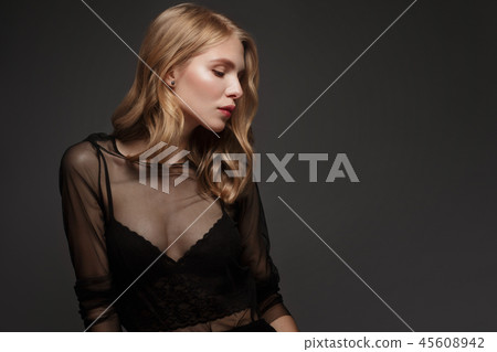 fashion model with long hair, perfect skin is posing in studio for glamour test photo shoot showing fashion model with long hair, perfect skin is posing in studio for glamour test photo shoot showing 45608942