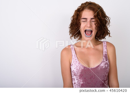 Portrait Of Young Woman Against White Background Portrait Of Young Woman Against White Background 45610420