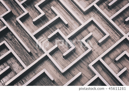 Wooden brown labyrinth maze puzzle close up 45611281
