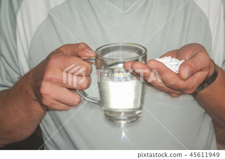 pills and water in hands pills and water in hands 45611949