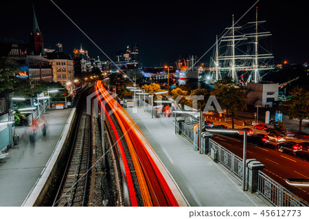 Landungsbruecken in Hamburg at night. Amazing light trails from the train movement. Urban cityscape Landungsbruecken in Hamburg at night. Amazing light trails from the train movement. Urban cityscape 45612773