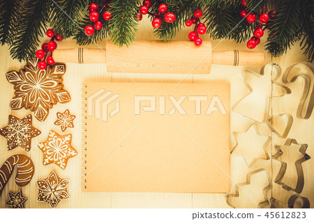 Christmas gingerbread and brown notebook. 45612823