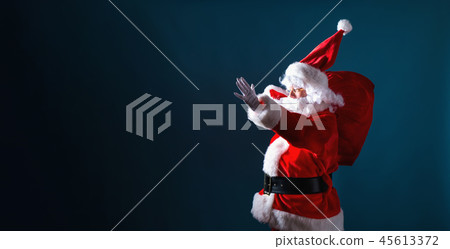 Santa holding a red sack Santa holding a red sack 45613372