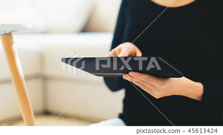 Young woman with a tablet computer Young woman with a tablet computer 45613424