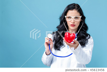 Medical doctor with a stethoscope and a heart concept Medical doctor with a stethoscope and a heart concept 45613456