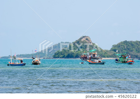 Wooden fishing boats anchor at the shallow water Wooden fishing boats anchor at the shallow water 45620122