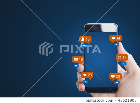 Hand holding mobile phone, with notification icons 45621905