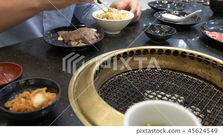 Korean barbecue grill. people cook and eat dishes cooked on a Korean grill in a restaurant. close-up 45624549