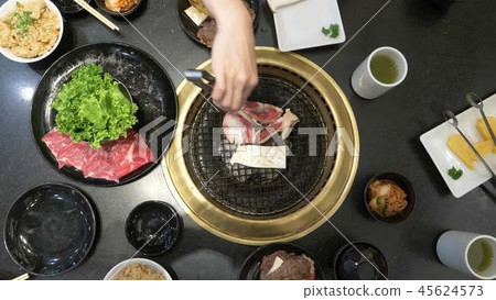 Korean barbecue grill. people cook and eat dishes cooked on a Korean grill in a restaurant. close-up 45624573