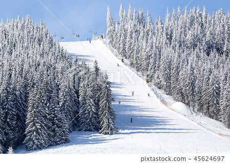 Mountain ski slope on winter resort at sunny day Mountain ski slope on winter resort at sunny day 45624697