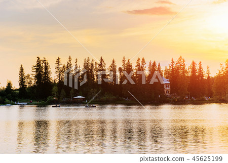 Sunset over the lake. Majestic mountain lake in National Park High Tatra. Strbske pleso, Slovakia 45625199