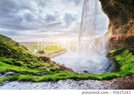 Seljalandfoss waterfall at sunset. Bridge over the river. Fantastic nature. Iceland 45625261