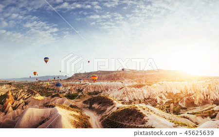 Fantastic sunrise over the Red Valley in Cappadocia, Anatolia, Turkey. Volcanic mountains 45625639
