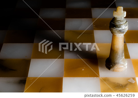 The black king on a stone chessboard 45626259