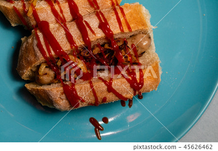 A delicious sausage sandwich in a homemade bread A delicious sausage sandwich in a homemade bread 45626462