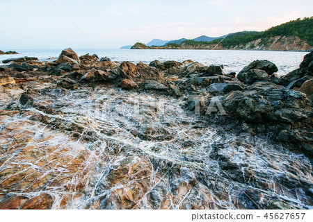 Huge rocks, cliffs and rocks along the coast. 45627657