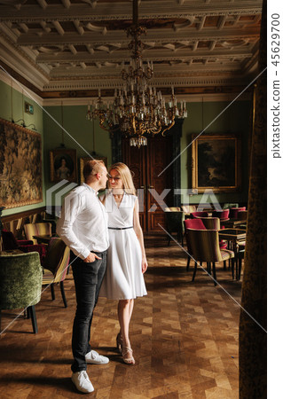 Young couple stand in they apatrament near the big window 45629700