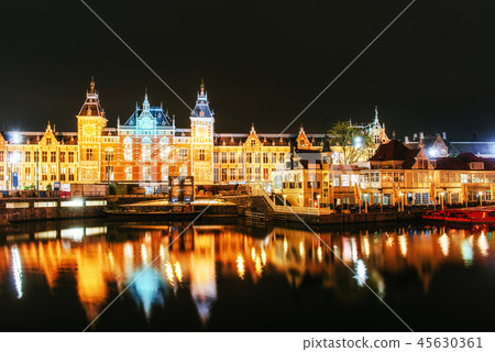Night illumination of buildings and boats near the water in the canal. Night illumination of buildings and boats near the water in the canal. 45630361
