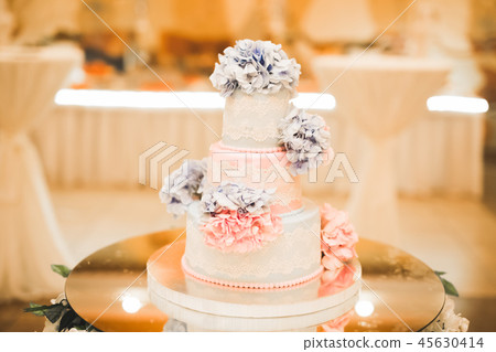 Luxury decorated wedding cake on the table Luxury decorated wedding cake on the table 45630414