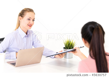 Giving resume to HR for job interview Giving resume to HR for job interview 45630757