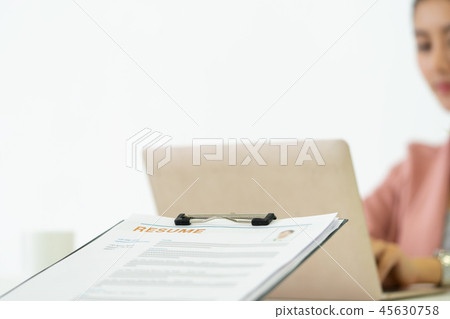 Giving resume to HR officer for job interview Giving resume to HR officer for job interview 45630758