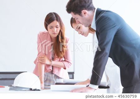 Female architect showing boss the real estate plan Female architect showing boss the real estate plan 45630759