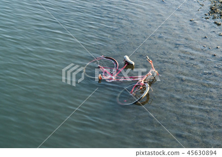 Bicycles illegally dumped in the river 45630894