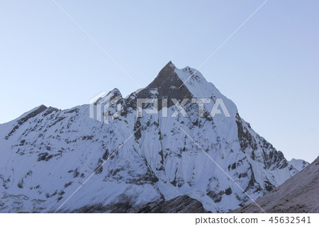 Machapuchare mountain with snow at sunrise Machapuchare mountain with snow at sunrise 45632541