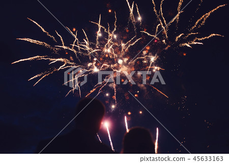 Crowd watching fireworks 45633163