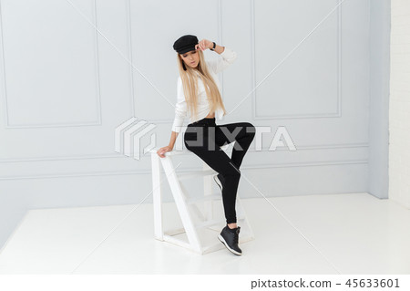 Fashion portrait of women in black and white suit Fashion portrait of women in black and white suit 45633601