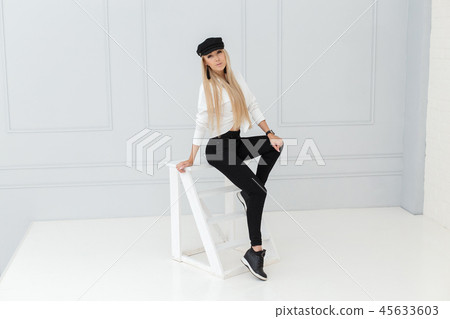 Fashion portrait of women in black and white suit Fashion portrait of women in black and white suit 45633603
