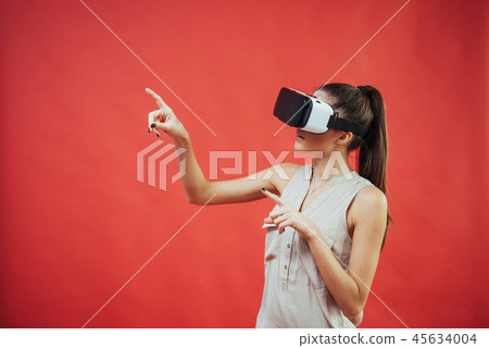 portrait of happy smiling young beautiful girl, gain experience using VR-headset virtual reality portrait of happy smiling young beautiful girl, gain experience using VR-headset virtual reality 45634004
