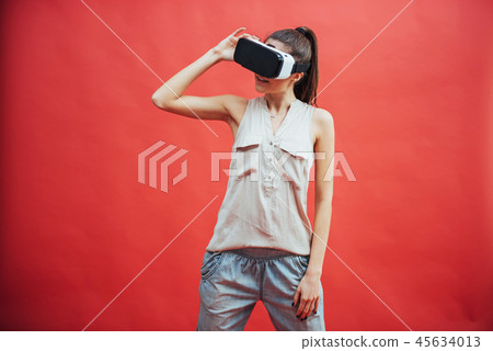 portrait of happy smiling young beautiful girl, gain experience using VR-headset virtual reality portrait of happy smiling young beautiful girl, gain experience using VR-headset virtual reality 45634013
