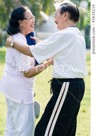 An elderly man wipe the sweat from his wife's face with towel 45634214
