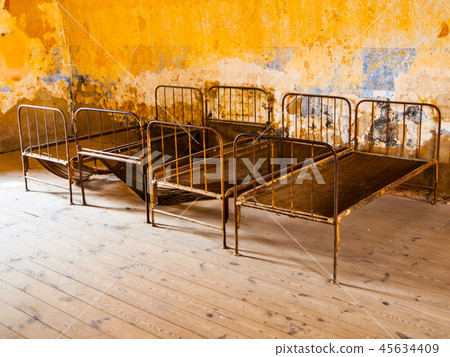 Old rusty beds in abandoned room Old rusty beds in abandoned room 45634409