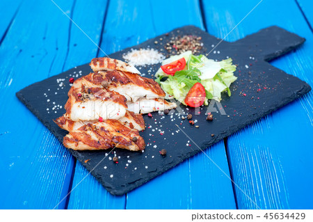 Grilled turkey fillet and vegetables in restaurant Grilled turkey fillet and vegetables in restaurant 45634429