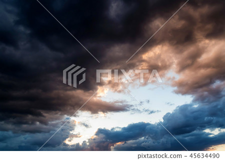 Dramatic evening sky with dark stormy clouds Dramatic evening sky with dark stormy clouds 45634490